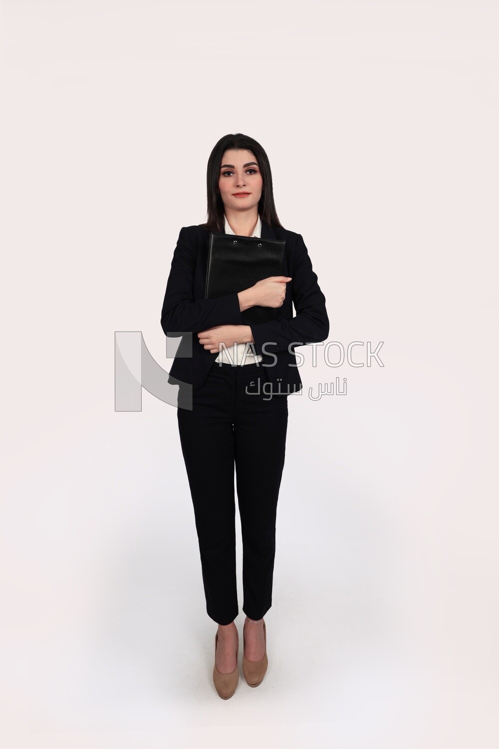 Photo of a businesswoman with a formal suit standing and holding documents, business development and partnerships, business meeting, Model
