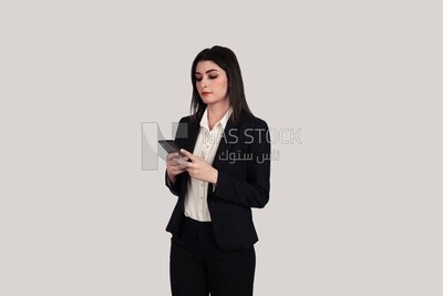 Photo of a businesswoman with formal wear holding a mobile phone, business development and partnerships, business meeting, Model