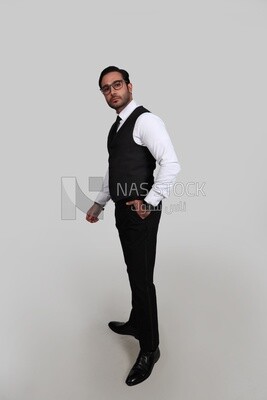 Photo of a businessman with a formal suit putting his hand in his pocket, business development and partnerships, business meeting, Model