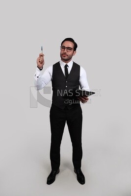 Photo of a businessman with a formal suit holding documents in one hand and a pen in the other, business development and partnerships, business meeting, Model