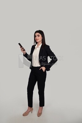 Photo of a businesswoman with formal wear holding a mobile phone, business development and partnerships, business meeting, Model