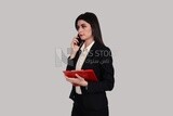 Photo of a businesswoman with formal wear standing and holding documents and checking her mobile, business development and partnerships, business meeting, Model