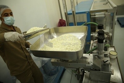 White medicine tablets come out from the manufacturing stage to the sterilization and disinfection stage