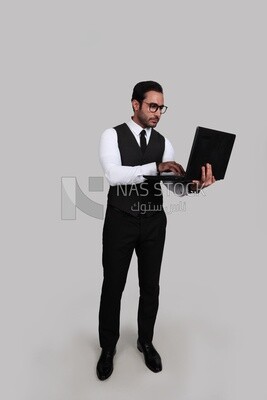 Photo of a businessman with a formal suit holding a laptop, business development and partnerships, business meeting, Model