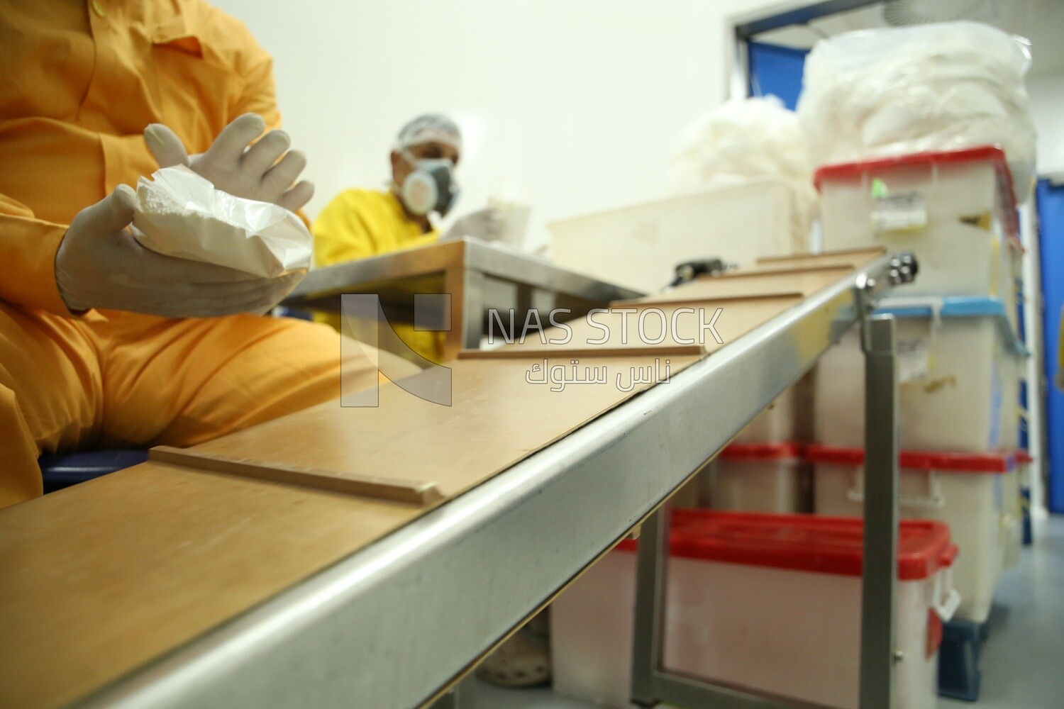 Specialist in a pharmaceutical factory secures the integrity of the bags of powdered medicines