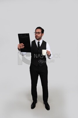 Photo of a businessman with a formal suit holding documents in one hand and a cup in the other, business development and partnerships, business meeting, Model