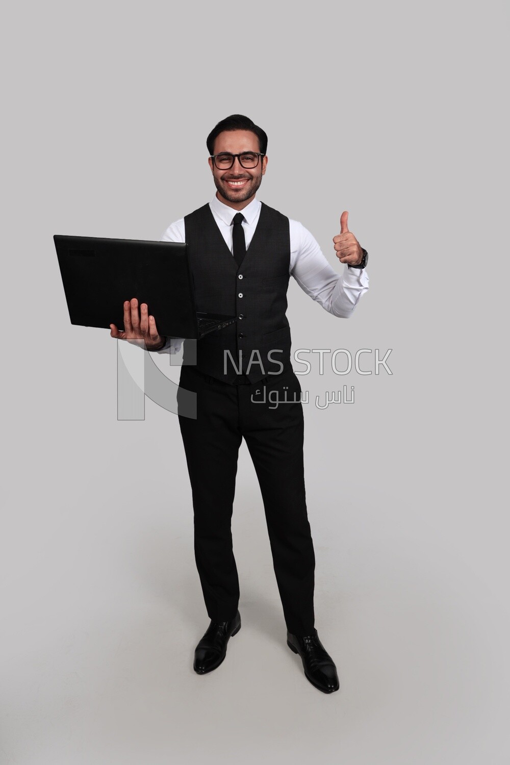 Photo of a businessman with a formal suit holding a laptop, business development and partnerships, business meeting, Model