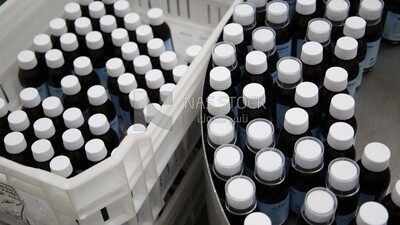 Medication bottles after filling and wrapping them