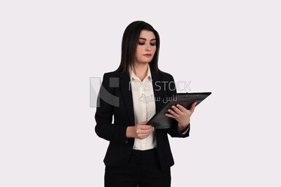 Photo of a businesswoman with a formal suit standing and holding documents, business development and partnerships, business meeting, Model