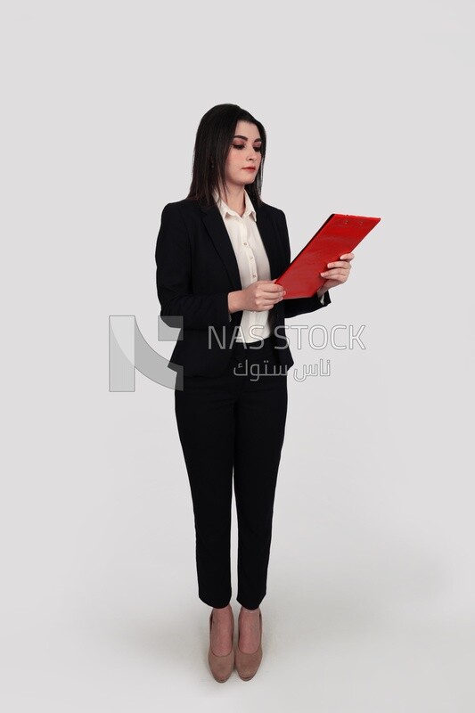 Photo of a businesswoman with a formal suit standing and holding documents, business development and partnerships, business meeting, Model