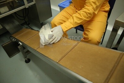 Stage of pressing and closing bags of artificial baby milk and bags of vitamin powder