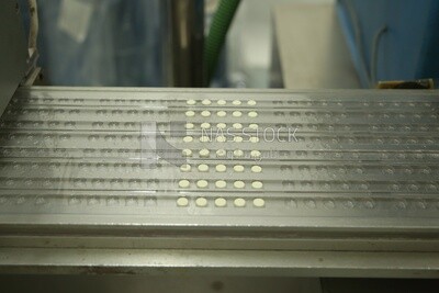 White medicine tablets come out from the manufacturing stage to the sterilization and disinfection stage