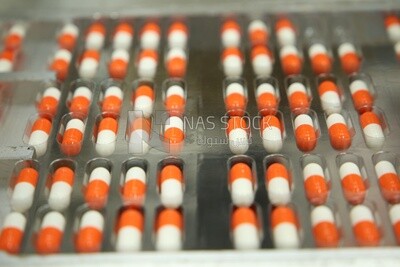 White and an orange capsule