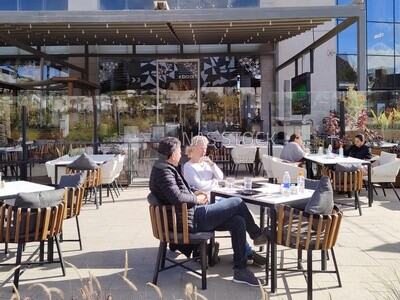 Foreign couple is sitting in a restaurant having breakfast