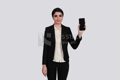 Photo of a businesswoman with a formal suit holding her mobile phone, business development and partnerships, business meeting, Model