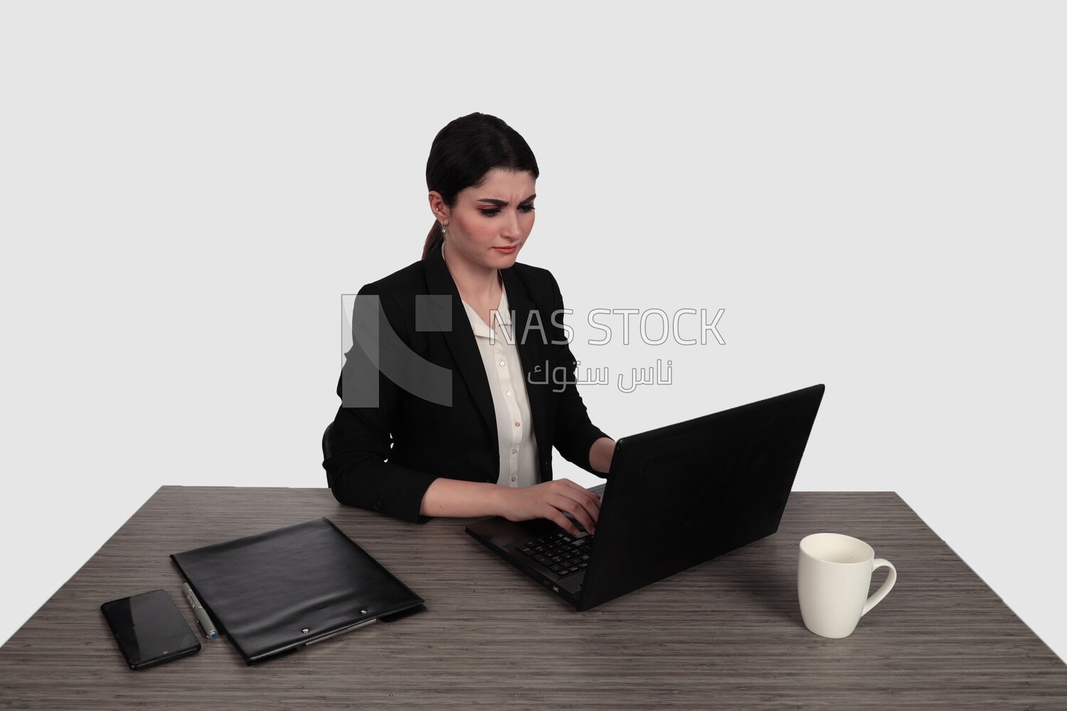 Photo of a businesswoman with a formal suit sitting at a desk working on a laptop, business development and partnerships, business meeting, Model