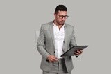 Photo of a businessman in a business suit checking documents, business development and partnerships, business meetings, models