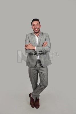 Photo of a businessman in a formal suit with crossed hands, business development and partnerships, business meeting, Model