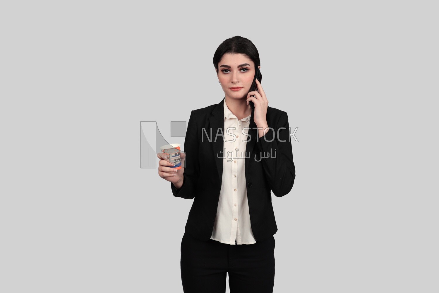 Photo of a businesswoman in formal wear holding a cup of tea and talking on the phone, business development and partnerships, business meeting, Model