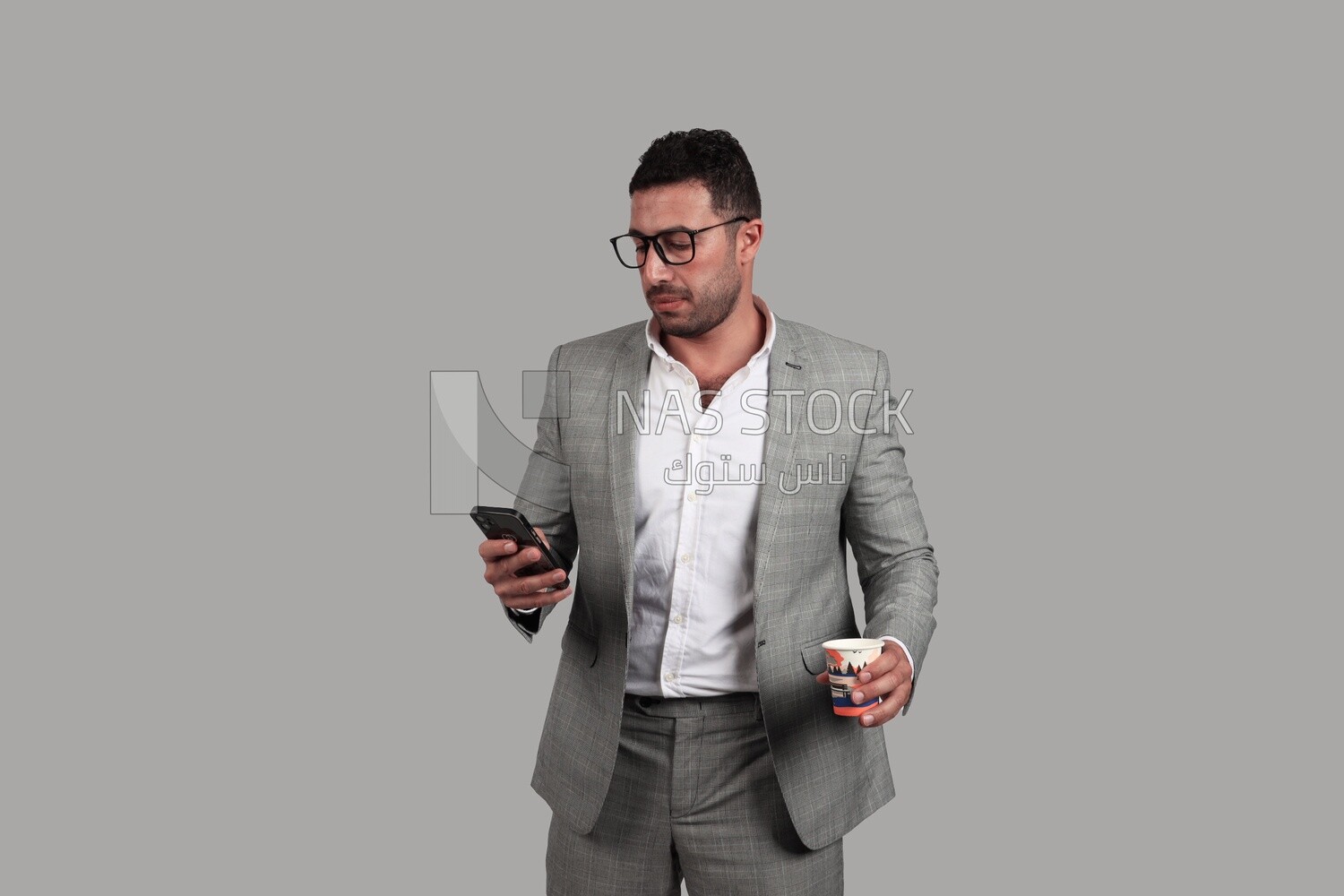 Photo of a businesswoman in formal wear standing and checking her mobile, business development and partnerships, business meeting, Model