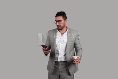 Photo of a businesswoman in formal wear standing and checking her mobile, business development and partnerships, business meeting, Model