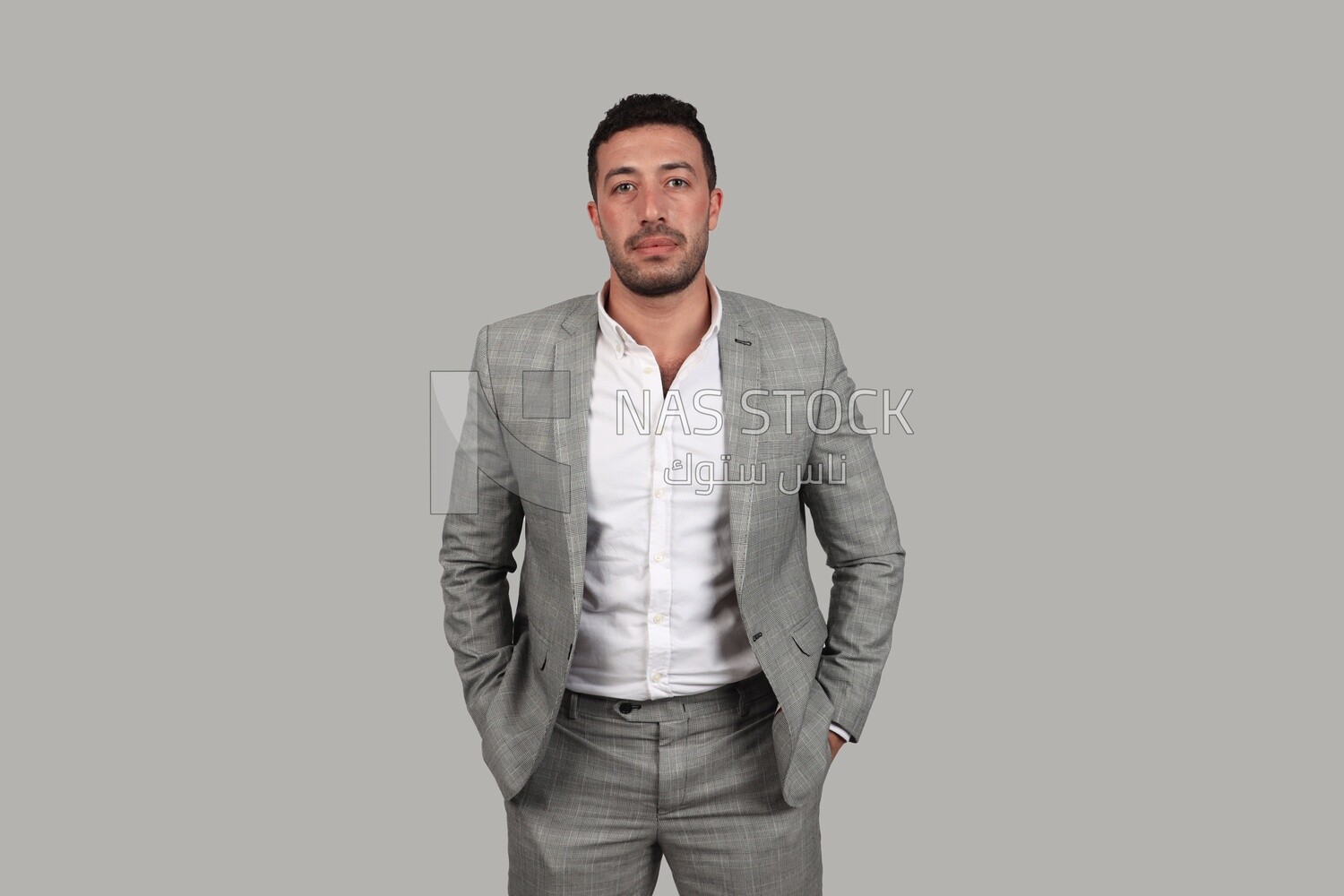 Photo of a businessman with a formal suit putting his hand in his pocket, business development and partnerships, business meeting, Model
