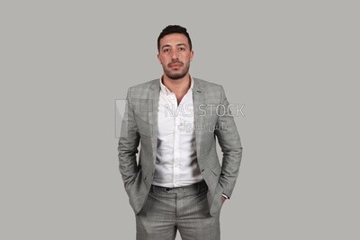 Photo of a businessman with a formal suit putting his hand in his pocket, business development and partnerships, business meeting, Model