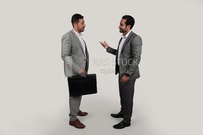 Photo of two men standing together, discussing work, business development and partnerships, business meeting, Model