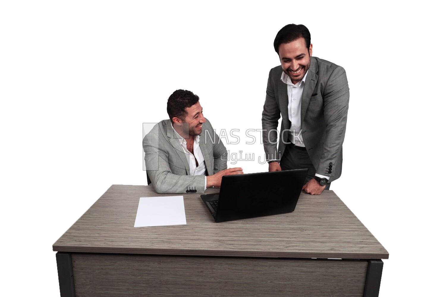 Photo of two men one sitting in the office and the other standing, discussing the work, business development and partnerships, business meeting, Model