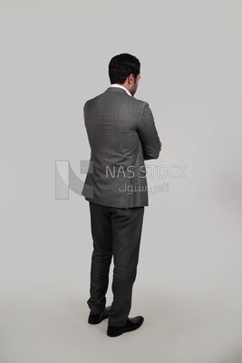 Photo of a businessman in a formal suit with crossed hands, business development and partnerships, business meeting, Model