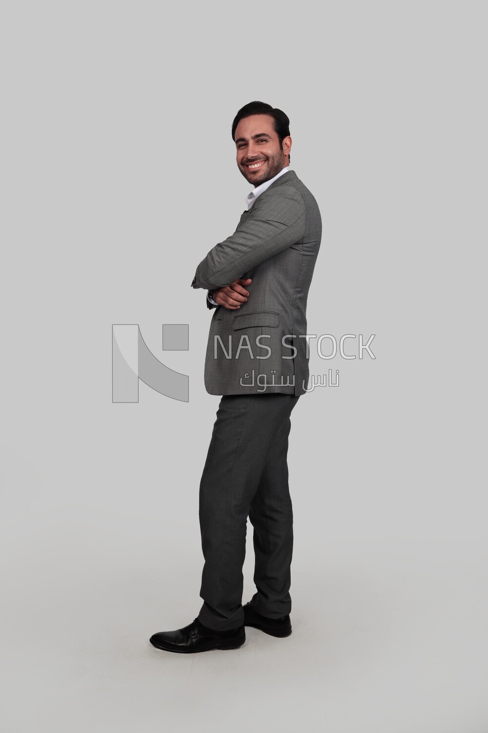 Side view for a photo of a businessman in a formal suit with crossed hands, business development and partnerships, business meeting, Model