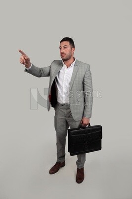Photo of a businessman with a formal suit holding a leather bag, business development and partnerships, business meeting, Model