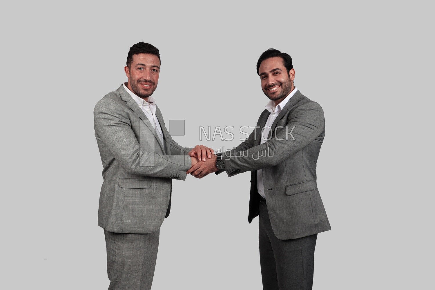 Photo of two businessmen shaking hands, business development and partnerships, business meeting, Model