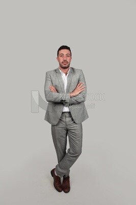Photo of a businessman in a formal suit with crossed hands, business development and partnerships, business meeting, Model