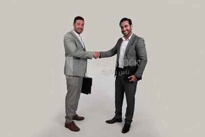 Photo of two businessmen shaking hands, business development and partnerships, business meeting, Model