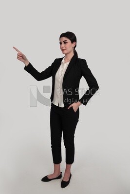 Photo of a businesswoman in formal wear standing pointing away, business development and partnerships, business meeting, Model