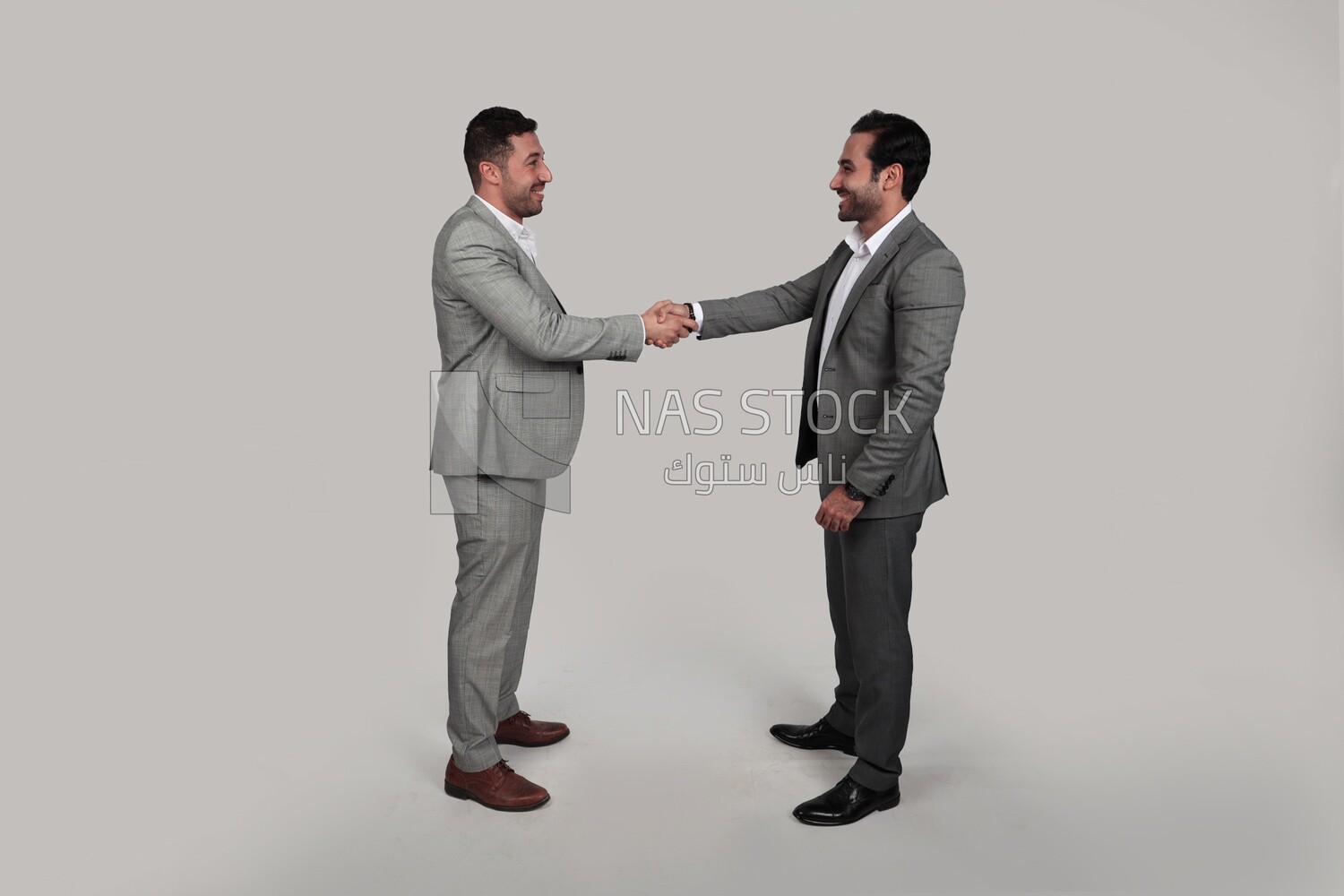 Photo of two businessmen shaking hands, business development and partnerships, business meeting, Model
