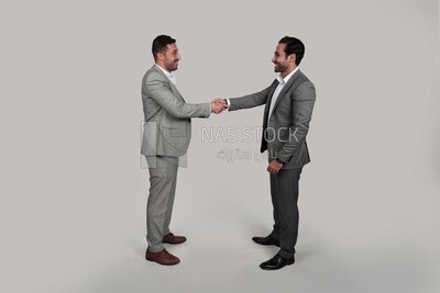 Photo of two businessmen shaking hands, business development and partnerships, business meeting, Model