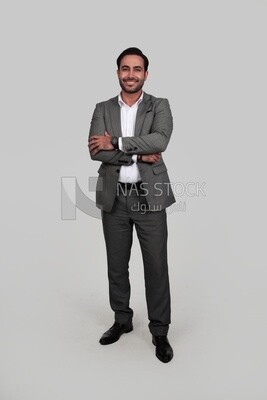 Photo of a businessman in a formal suit with crossed hands, business development and partnerships, business meeting, Model