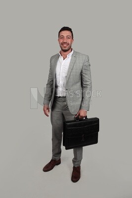 Photo of a businessman with a formal suit holding a leather bag, business development and partnerships, business meeting, Model