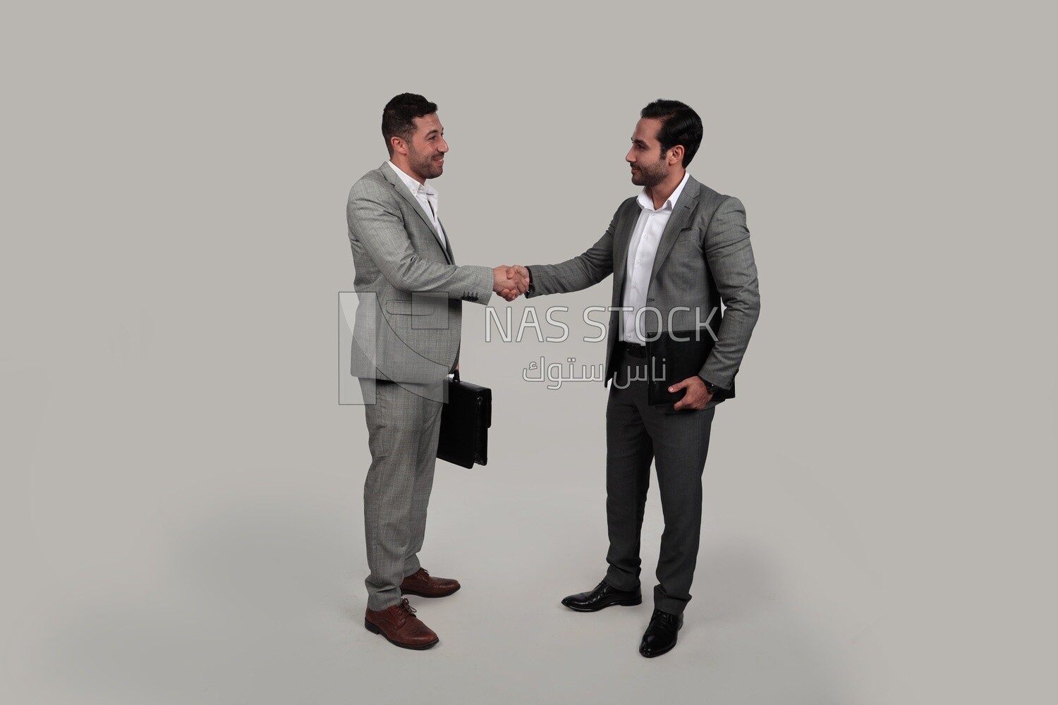 Photo of two businessmen shaking hands, business development and partnerships, business meeting, Model