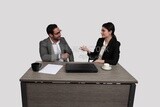 Photo of a businessman and a businesswoman sitting in the office discussing the work, business development and partnerships, business meeting, Model