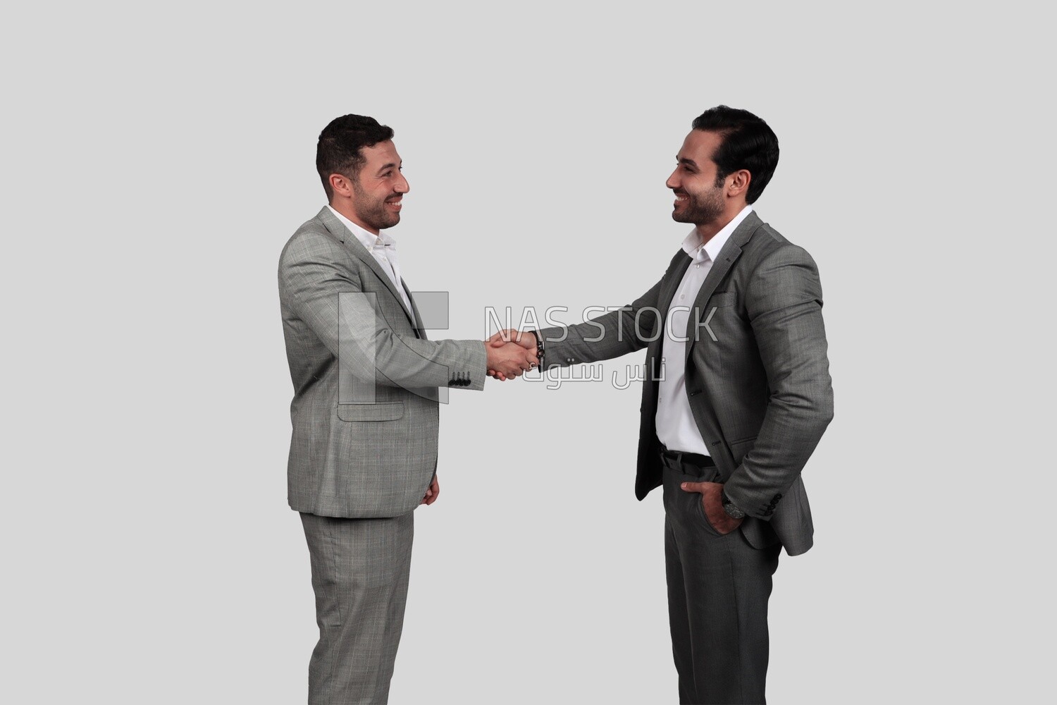 Photo of two businessmen shaking hands, business development and partnerships, business meeting, Model