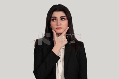 Photo of a businesswoman in formal wear standing looks like she is thinking, business development and partnerships, business meeting, Model