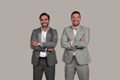 Photo of two businessmen standing with crossed hands, business development and partnerships, business meeting, Model