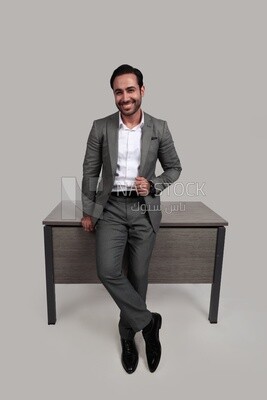 Photo of a businessman in a formal suit leaning on the office, business development and partnerships, business meeting, model