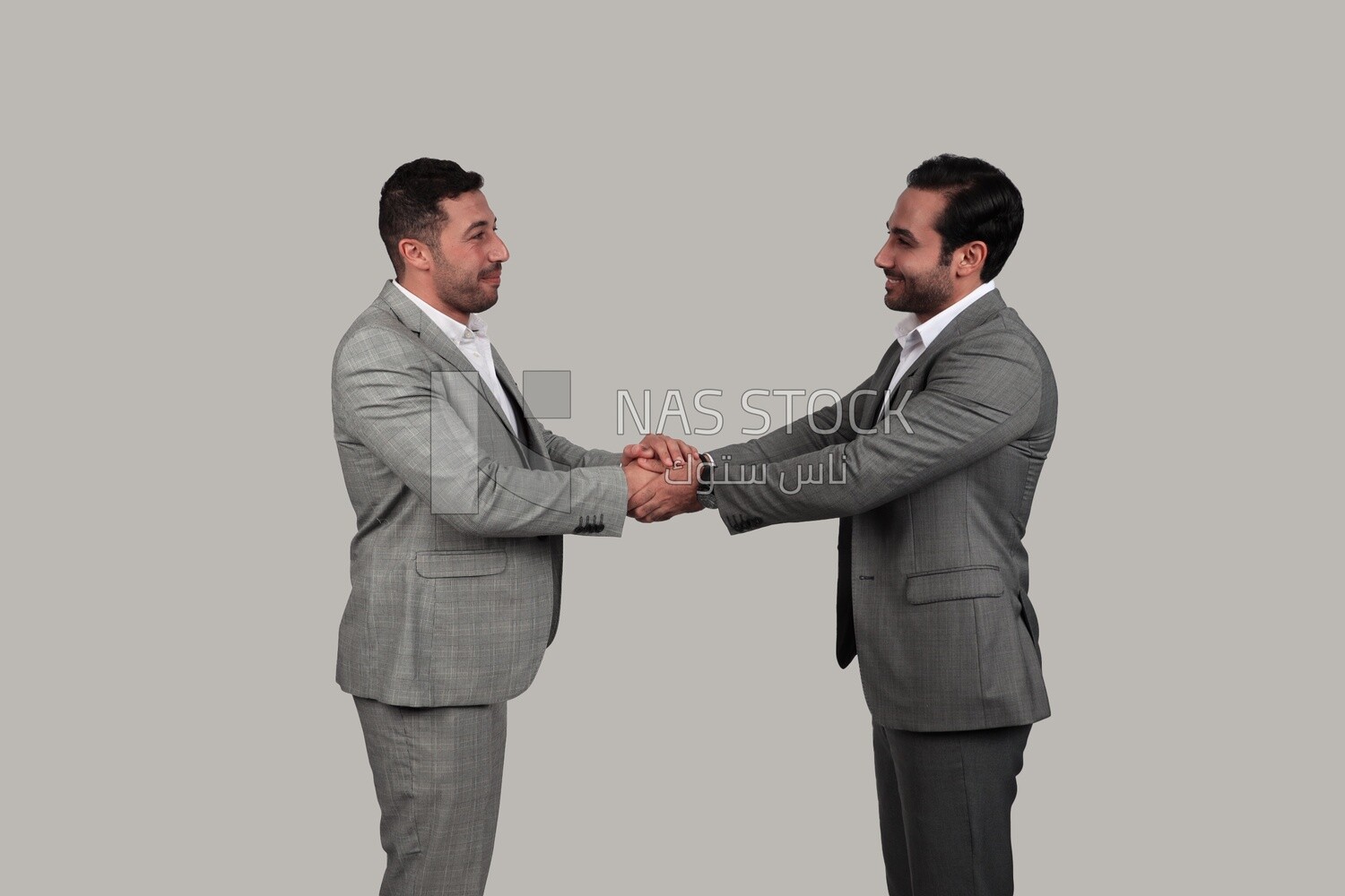 Photo of two businessmen shaking hands, business development and partnerships, business meeting, Model