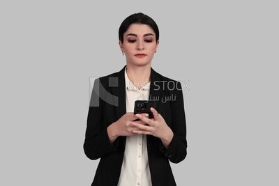 Photo of a businesswoman in formal wear standing and checking her mobile, business development and partnerships, business meeting, Model