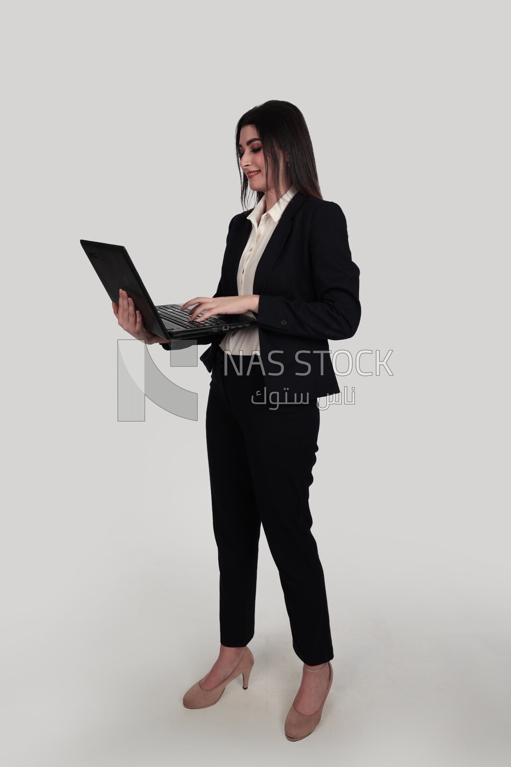 Photo of a businesswoman with a formal suit holding a laptop, business development and partnerships, business meeting, Model