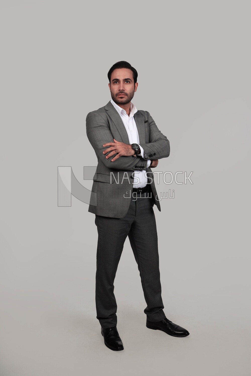 Photo of a businessman in a formal suit with crossed hands, business development and partnerships, business meeting, Model